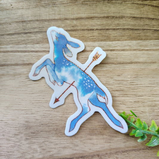 a wounded fawn pierced by an arrow sticker